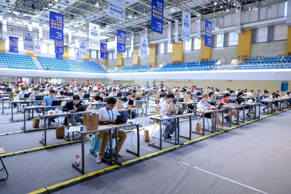 IOAI 2025 competition hall in Beijing: students at laptops